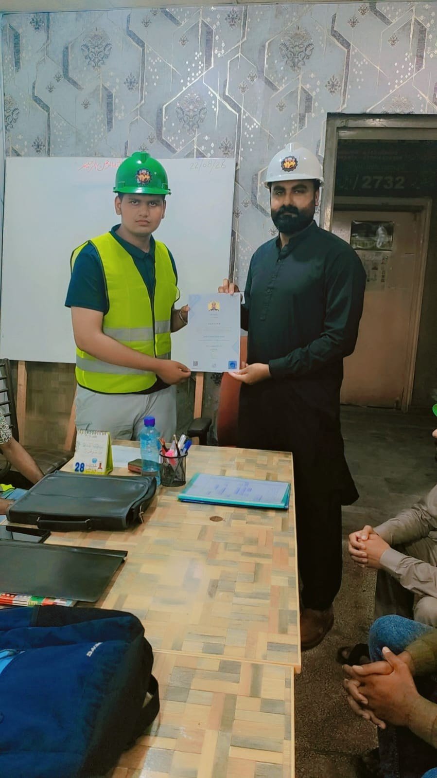 Trainee receiving certificate of completion