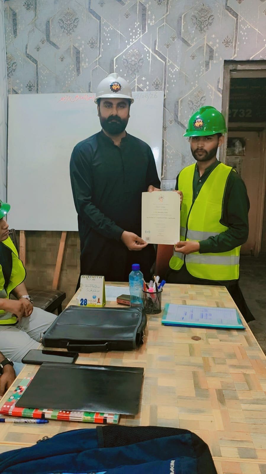 Trainee receiving certificate of completion