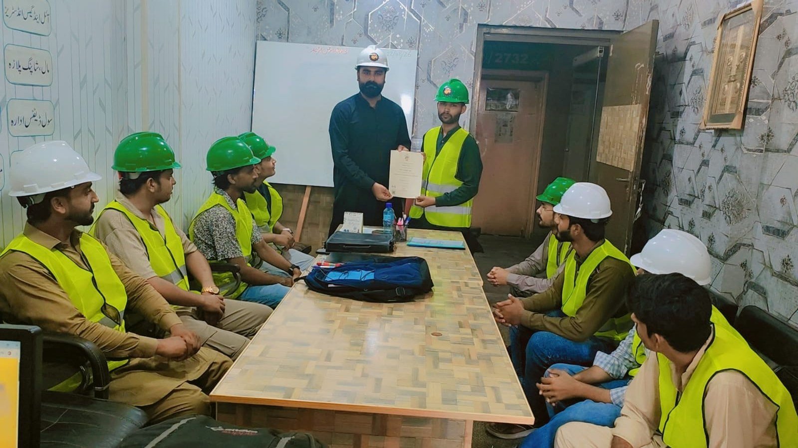 Certificate presentation ceremony in the training room