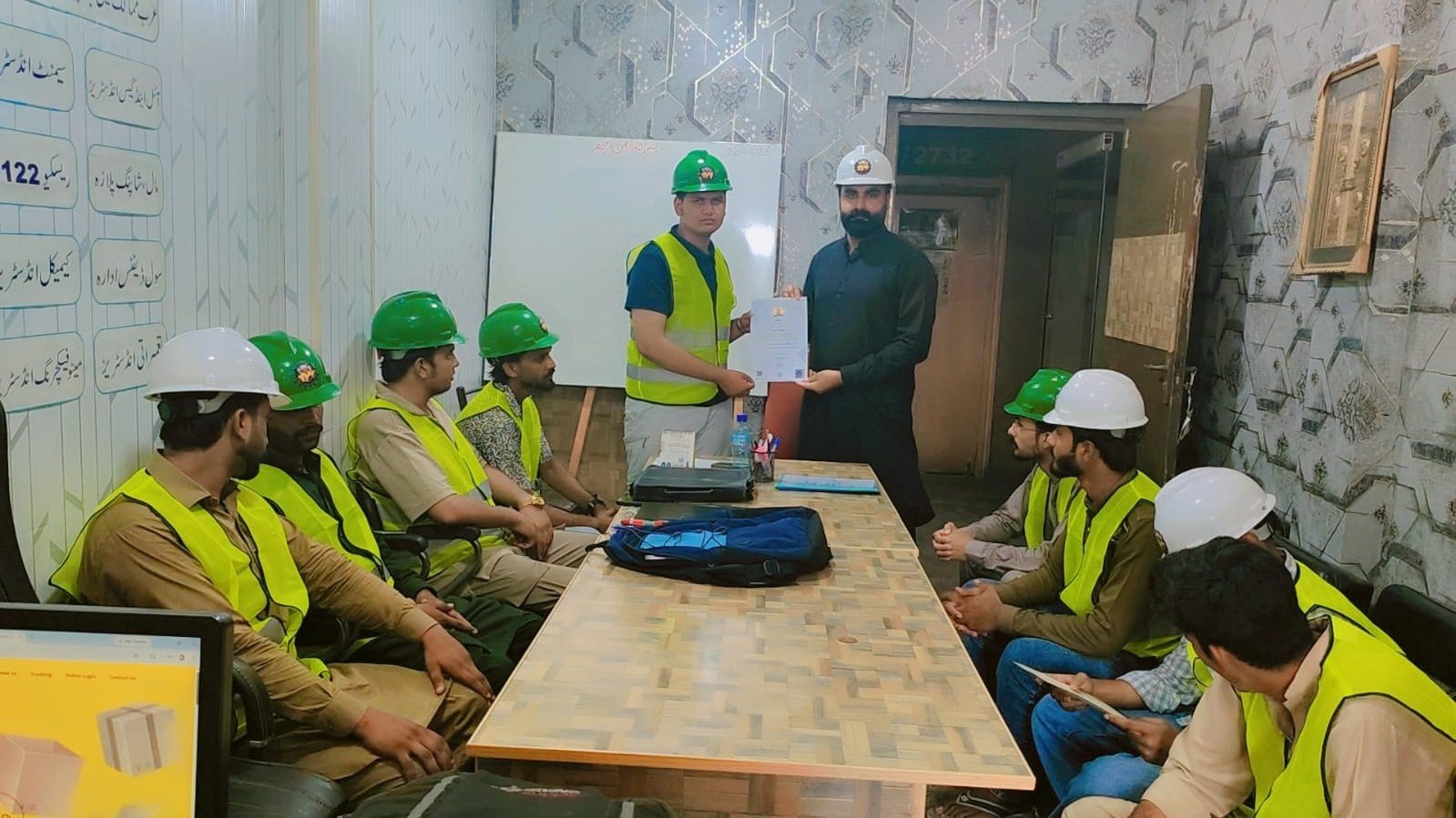 Certificate presentation ceremony in the training room