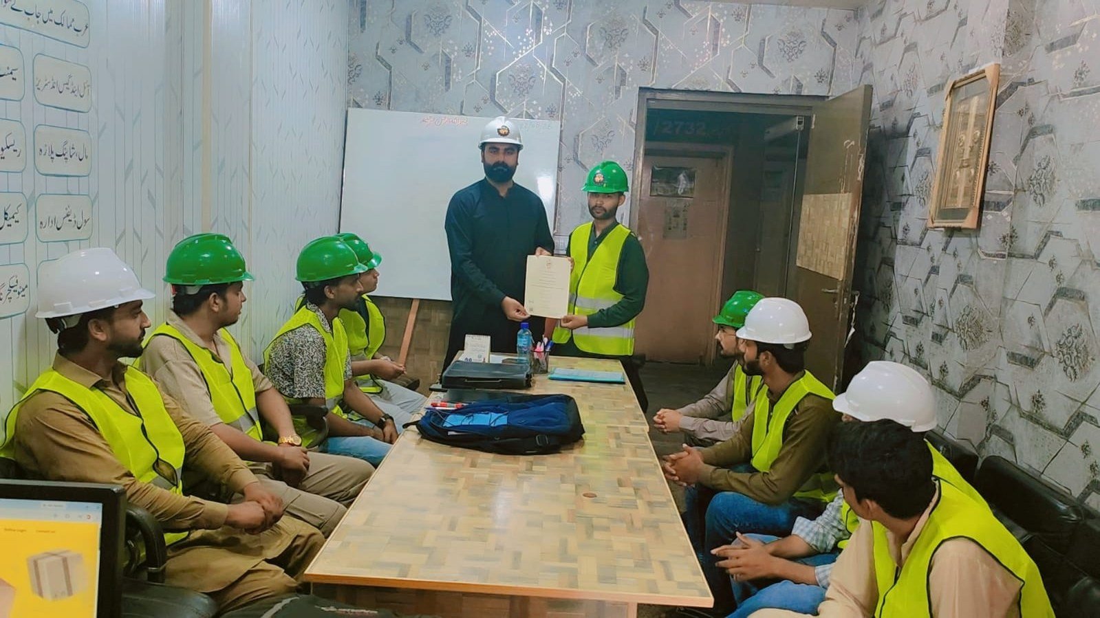 Certificate presentation ceremony in the training room