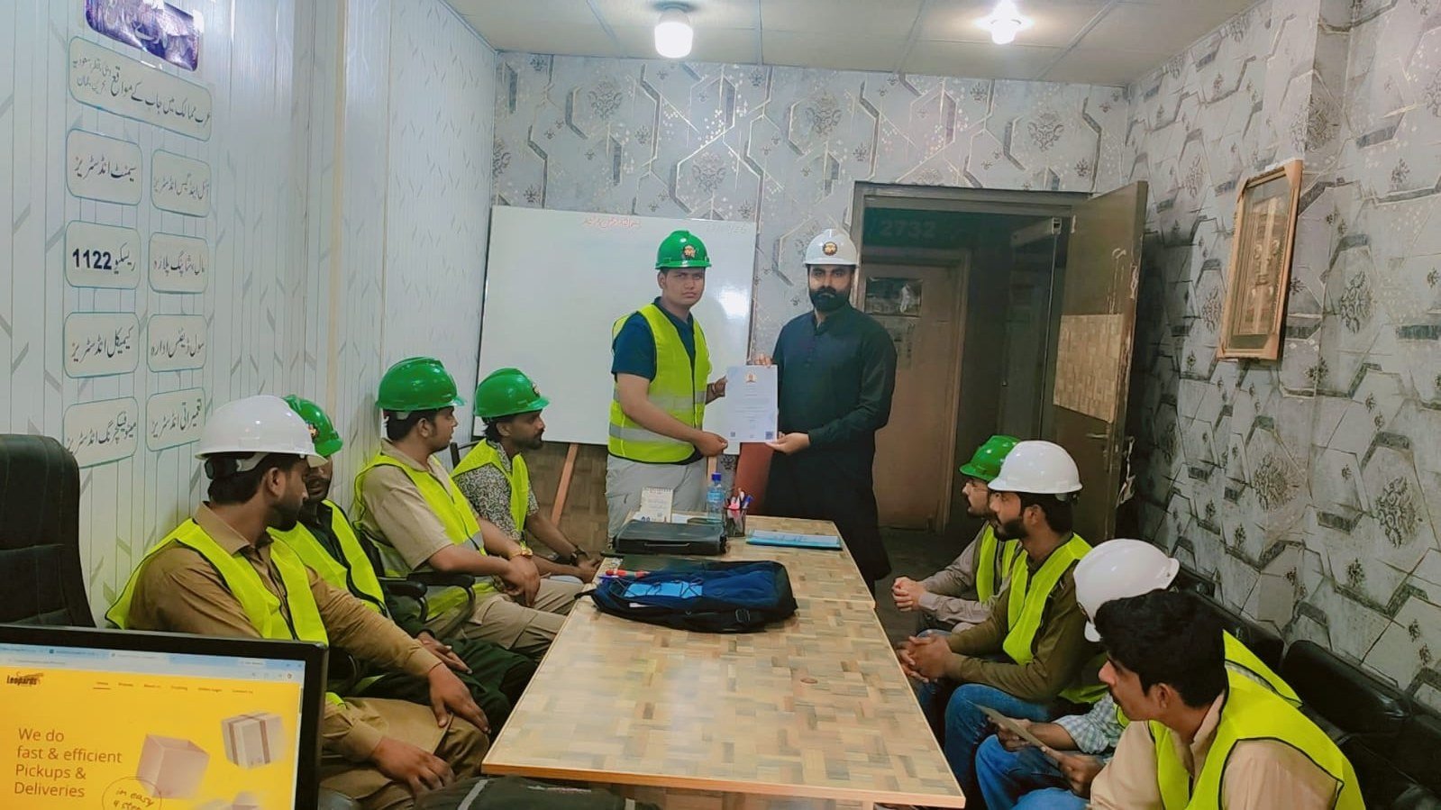Certificate presentation ceremony in the training room