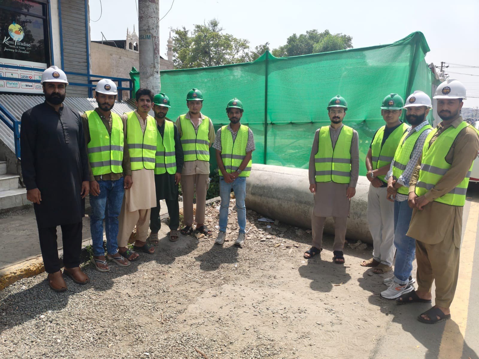 Trainees in high-visibility vests on a site visit