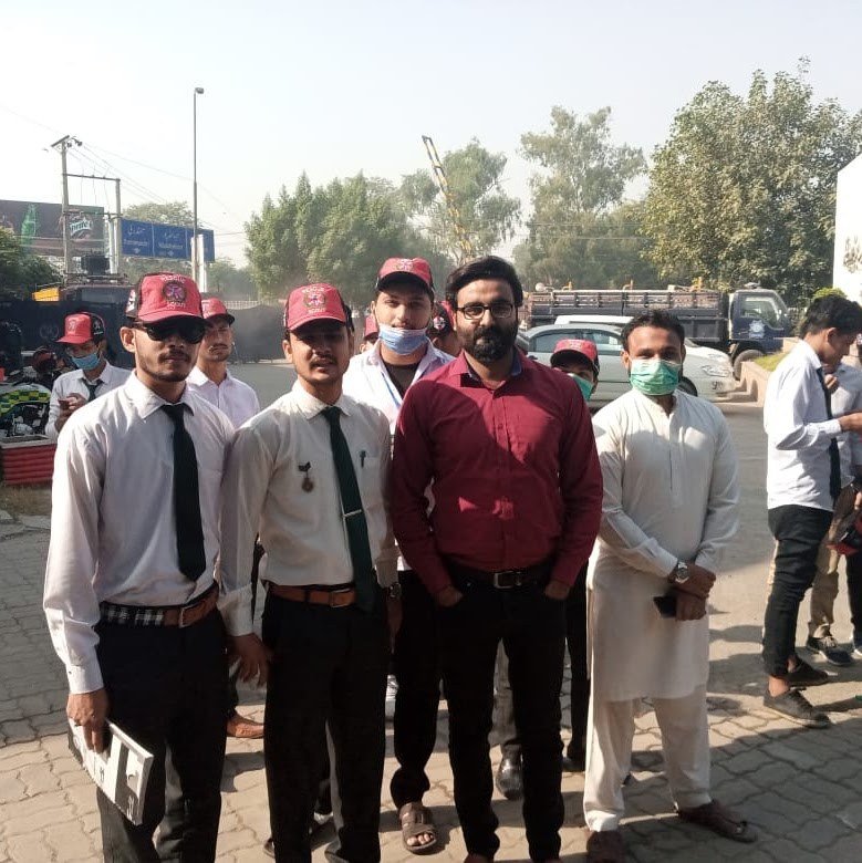 Students in red caps at an outdoor safety event